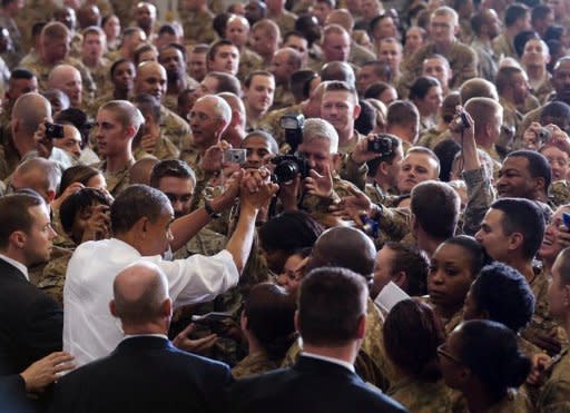 US President Barack Obama greets troops during a visit to Bagram Air Field in Afghanistan. Obama signed a US-Afghanistan strategic partnership agreement during his unannounced visit to the country