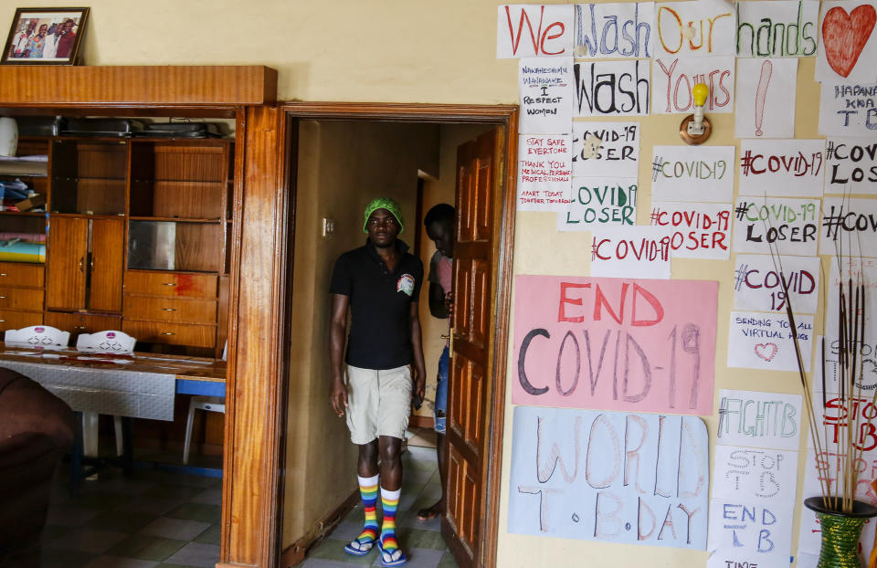 In this photo taken Thursday, June 11, 2020, gay Ugandan refugee Chris Wasswa walks in the house that serves as a shelter for him and other LGBT refugees in Nairobi, Kenya. Kenya is the only East African nation where someone can seek asylum and be registered as a refugee based on their LGBT status. But they still face discrimination and violence, and gay sex is still criminalized in Kenya. (AP Photo/Brian Inganga)