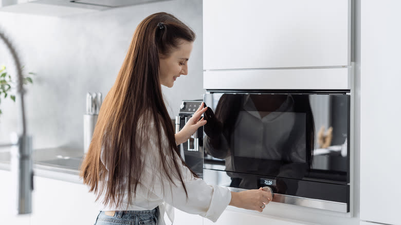 Woman microwaving