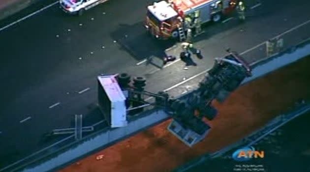 Truck hanging from the bridge. Photo: 7News