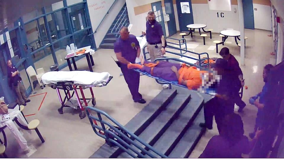 An image taken from a video inside the Franklin County Juvenile Detention Center on May 7 shows Damarion Allen, 15, on a stretcher after he got into a fight that paralyzed him from the chest down before guards dragged him to his cell.
