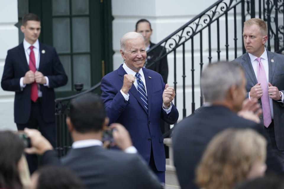 President Joe Biden cheers on rider at the White House in Washington, Thursday, June 23, 2022, during an event to welcome wounded warriors, their caregivers and families to the White House as part of the annual Soldier Ride to recognize the service, sacrifice, and recovery journey for wounded, ill, and injured service members and veterans. (AP Photo/Susan Walsh)