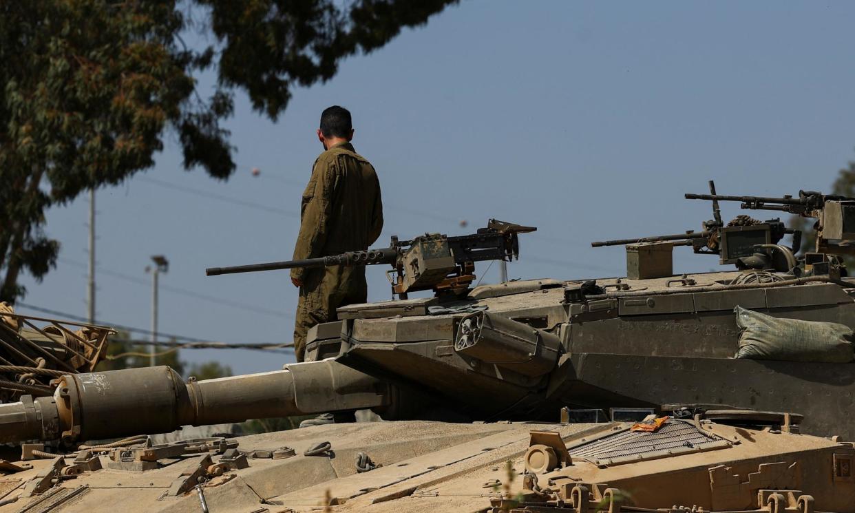<span>An Israeli tank on the Israel-Gaza border yesterday.</span><span>Photograph: Hannah McKay/Reuters</span>