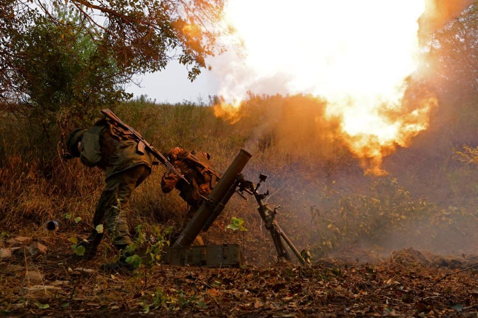 Separatist Pro-Russian troops fire a mortar towards Avdiivka in this September photo (REUTERS)