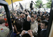 <p>Presidential hopeful Sen. John McCain has a picture taken with a supporter before getting back onto his campaign bus after a McCain 2008 rally in Manchester, N.H., Wednesday evening, April 25, 2007. McCain offically announced his candidacy for president during a campaign rally in Portsmouth. (Photo: Stephan Savoia/AP) </p>