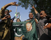 Supporters of former Pakistani Prime Minister Nawaz Sharif shout slogans after a court ruling, outside the Islamabad High Court in Islamabad, Pakistan, Wednesday, Sept. 19, 2018. The Pakistani court suspended the prison sentences of Sharif, his daughter and son-in-law on Wednesday and set them free on bail pending their appeal hearings. The court made the decision on the corruption case handed down to the Sharifs by an anti-graft tribunal earlier this year. (AP Photo/Anjum Naveed)