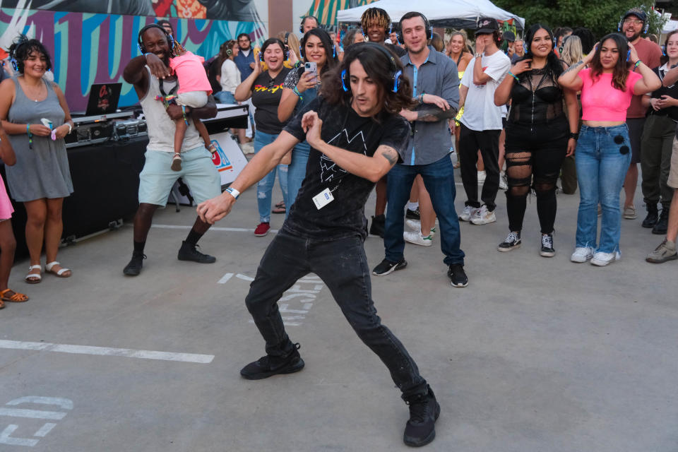 Stetson Smith from KMAR local news shows off his dance moves Saturday at the 4th annual Hoodoo Music Festival in downtown Amarillo.