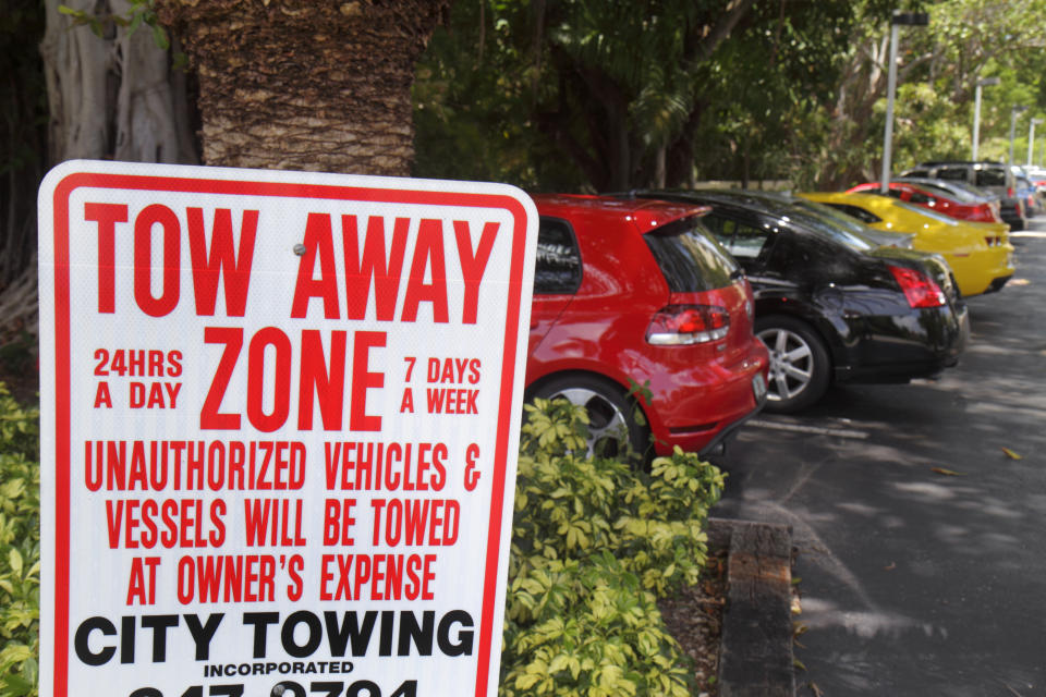 A tow away zone sign at the parking lot at The Bridge Hotel. (Photo by: Jeffrey Greenberg/Universal Images Group via Getty Images)