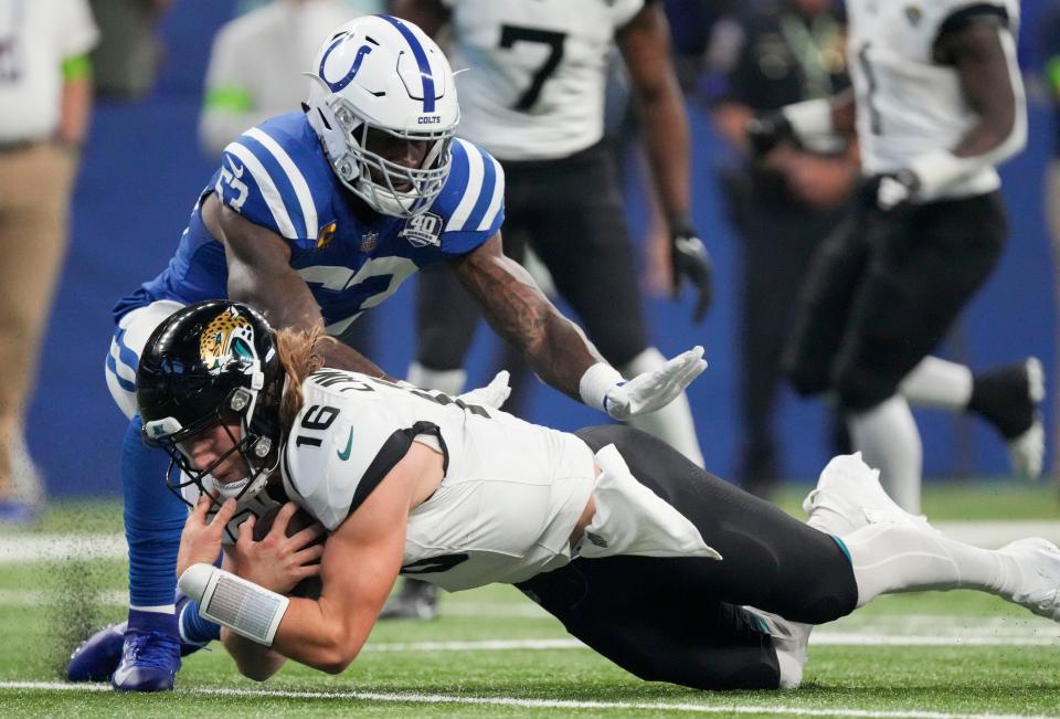 Indianapolis Colts linebacker Shaquille Leonard (53) moves in as Jacksonville Jaguars quarterback Trevor Lawrence (16) goes to the turf with the ball.