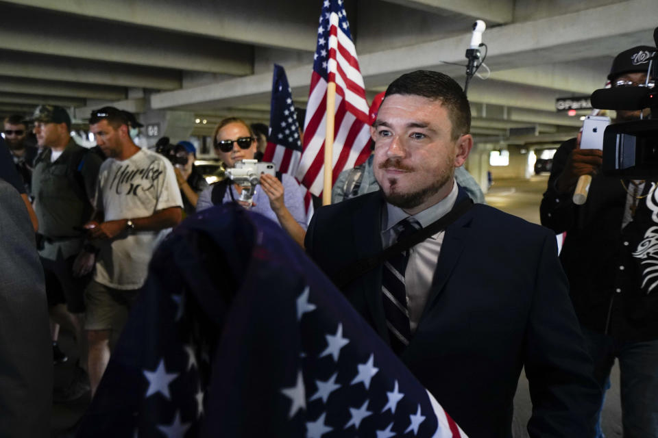 White nationalist Jason Kessler arrives at the Vienna metro station in Vienna, Va., Sunday, Aug. 12, 2018. White nationalists are gathering in Washington on the first anniversary of their rally in Charlottesville. (AP Photo/Sait Serkan Gurbuz)