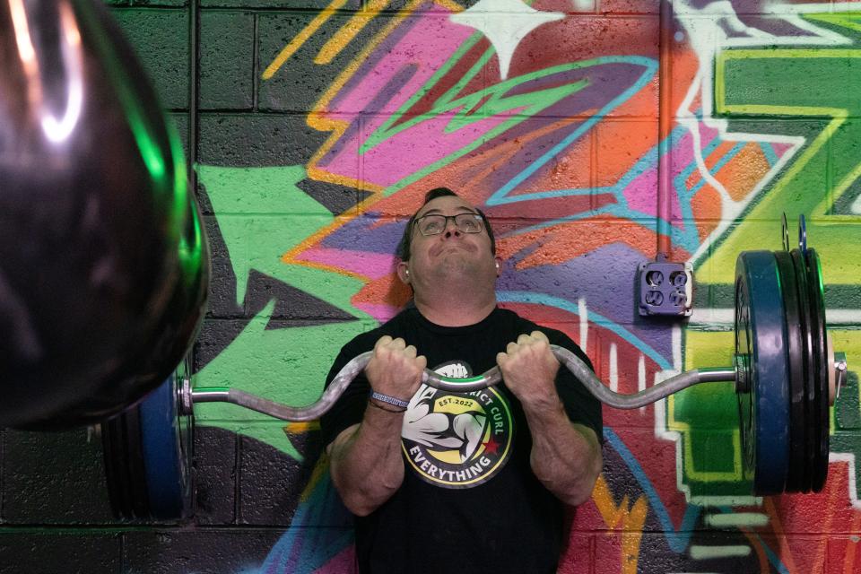 Oct 26, 2023; Livingston, NJ, USA; Brian Bellwood trains at Zapp Fitness for an upcoming bicep curl competition.
