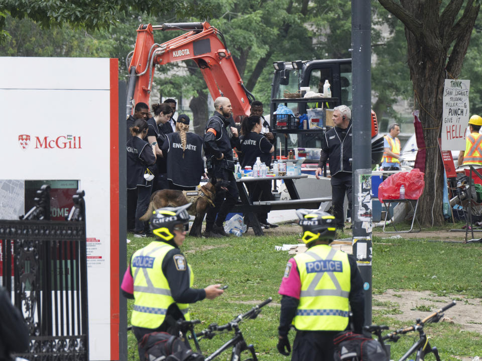 Private security workers dismantle the encampment on McGill University campus Wednesday, July 10, 2024, in Montreal. (Ryan Remiorz/The Canadian Press via AP)