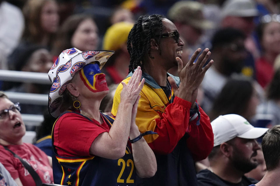 Indiana Fever fans cheer during the second half of a WNBA basketball game against the New York Liberty, Saturday, July 6, 2024, in Indianapolis. Indiana won 83-78. (AP Photo/Darron Cummings)