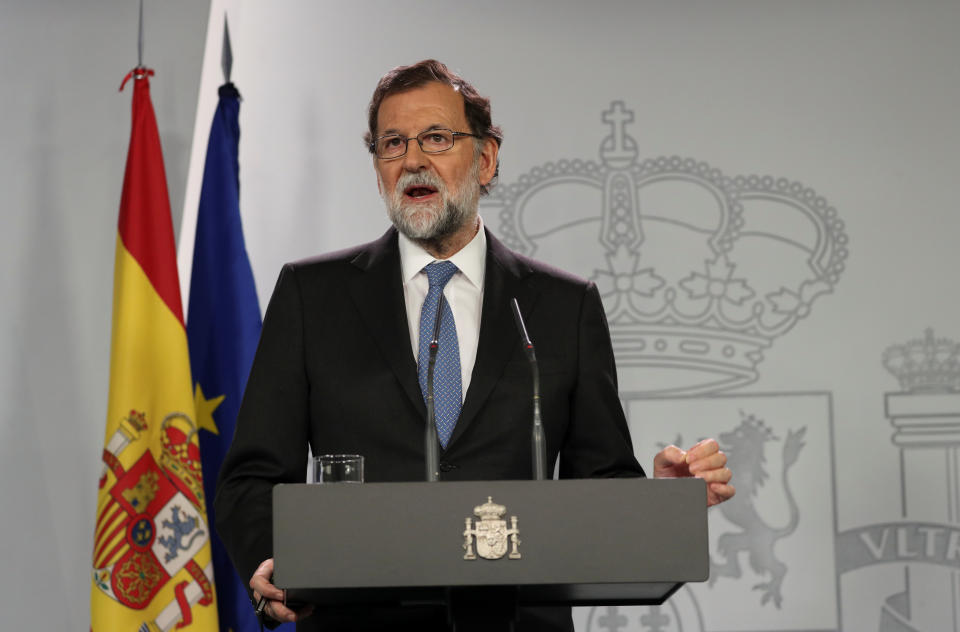 Spain's Prime Minister Mariano Rajoy delivers a statement after an extraordinary Cabinet meeting at the Moncloa Palace in Madrid on Friday. (Photo: Susana Vera / Reuters)