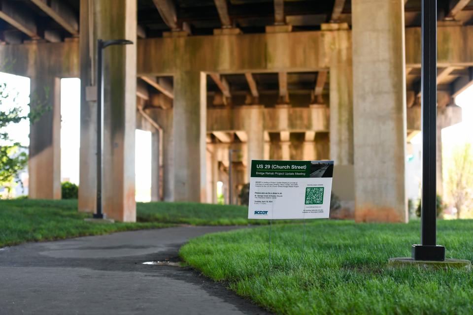 A sign for a project update meeting is seen underneath US 29/Church Street Bridge on Wednesday, April 3, 2024.