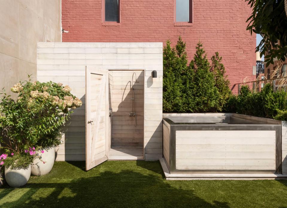 an outdoor shower and plunge pool on a roof terrace