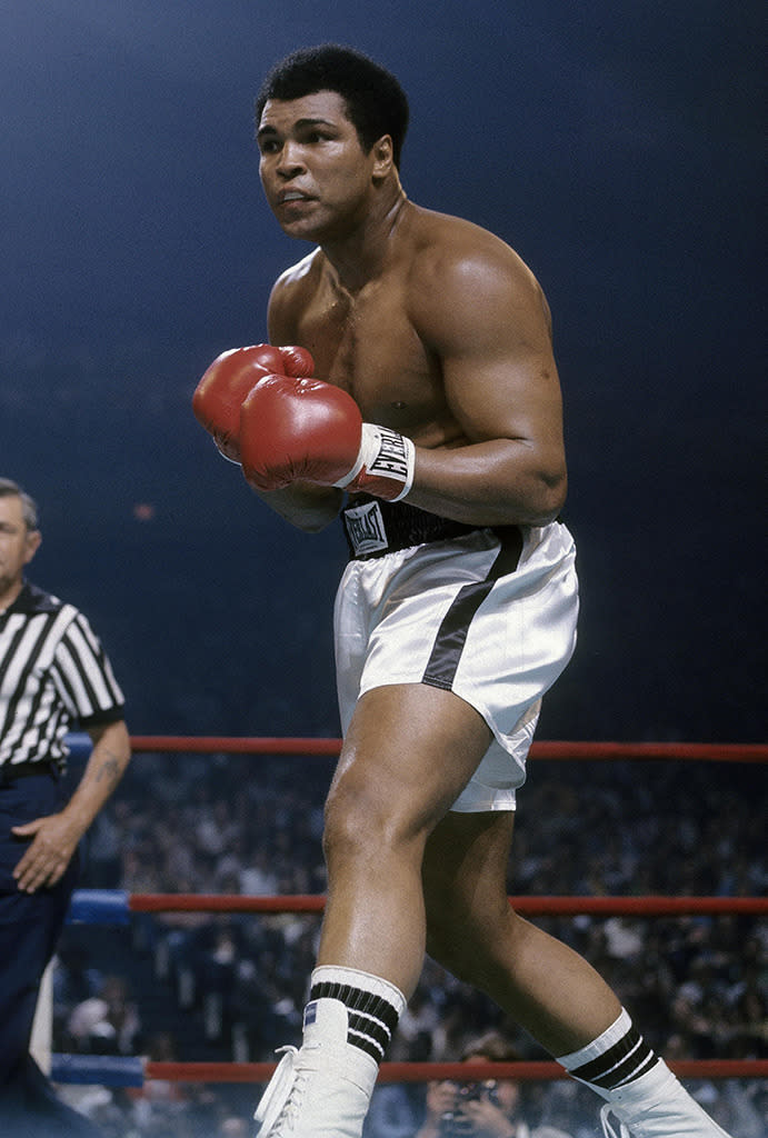 Ali looks for an opening against Alfredo Evangelista during a WBC/WBA heavyweight championship fight.