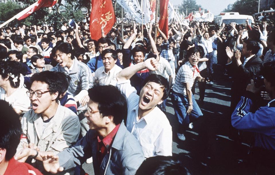 File - Chinese students shout after breaking through a police blockade during a pro-democracy march to Tiananmen Square, Beijing, May 4, 1989. An exhibit will open Friday, June 2, 2023, in New York, ahead of the June 4 anniversary of the violence that ended China's 1989 Tiananmen protests. (AP Photo/S. Mikami)