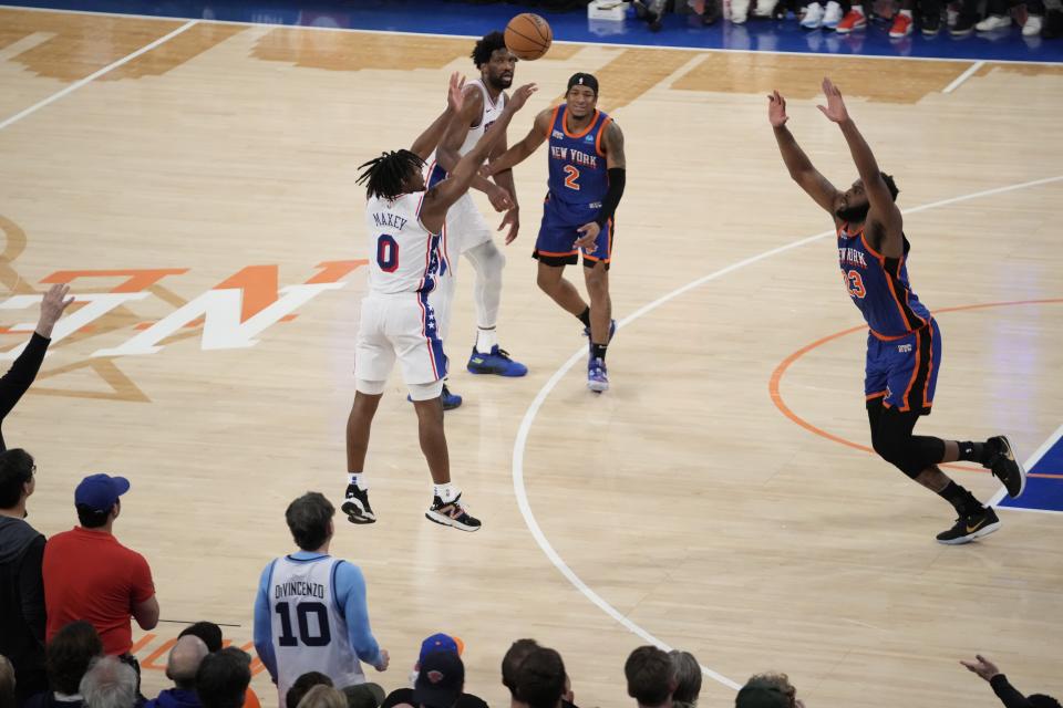 Philadelphia 76ers' Tyrese Maxey (0) shoots over New York Knicks' Mitchell Robinson (23) during the overtime period of Game 5 in an NBA basketball first-round playoff series, Tuesday, April 30, 2024, in New York. The 76ers won 112-106 in overtime. (AP Photo/Frank Franklin II)