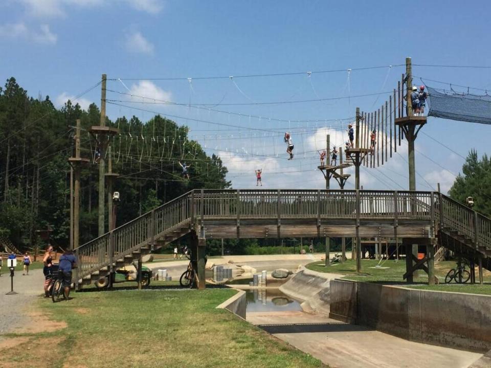 Visitors use the Whitewater Center’s rope course.