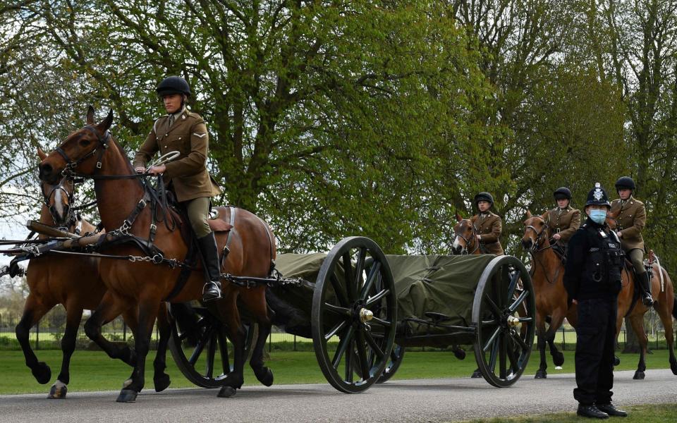 Members of the Kings Troop Royal Horse Artillery ride their horses into the grounds of Windsor Castle in Windsor, west of London, on April 15, - AFP