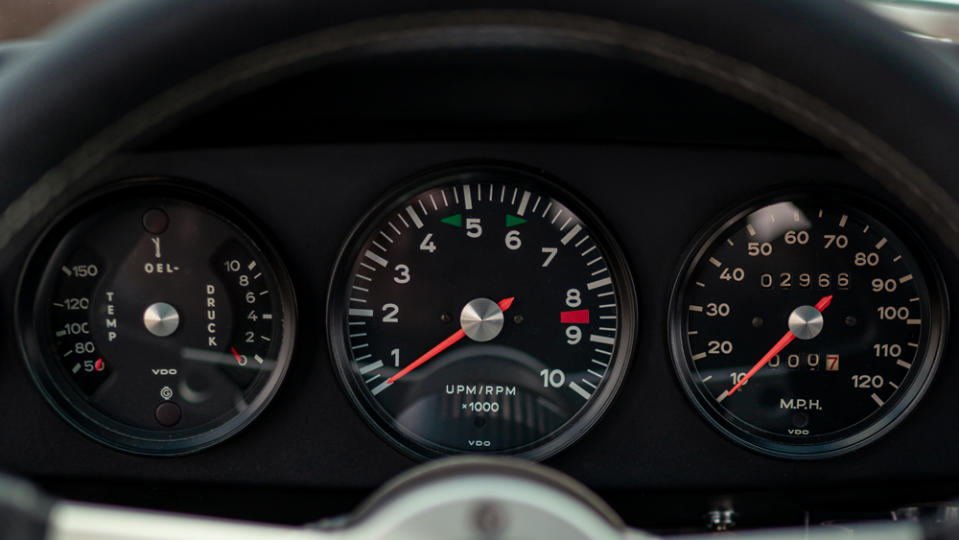 A close-up of Porsche's traditional five-dial dashboard inside a Kamm 912c restomod.