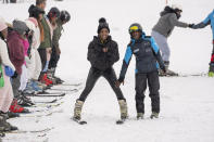 Kafi Mojapelo takes her first ski lesson at the Afriski ski resort near Butha-Buthe, Lesotho, Saturday July 30, 2022. While millions across Europe sweat through a summer of record-breaking heat, Afriski in the Maluti Mountains is Africa's only operating ski resort south of the equator. It draws people from neighboring South Africa and further afield by offering a unique experience to go skiing in southern Africa. (AP Photo/Jerome Delay)