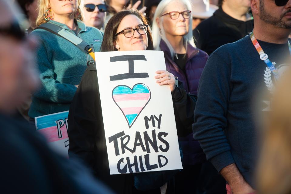 A demonstrator holds a sign as hundreds gather in downtown Knoxville Feb. 13 in support of LGBTQIA+ rights and in protest of state legislation that limits drag performances in public spaces.