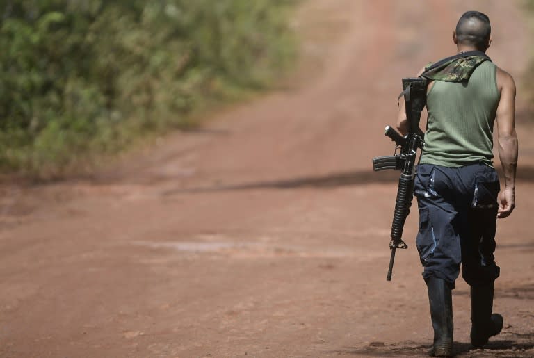 A FARC fighter stands guard at a rebel camp in El Diamante, Caqueta department, on September 25, 2016