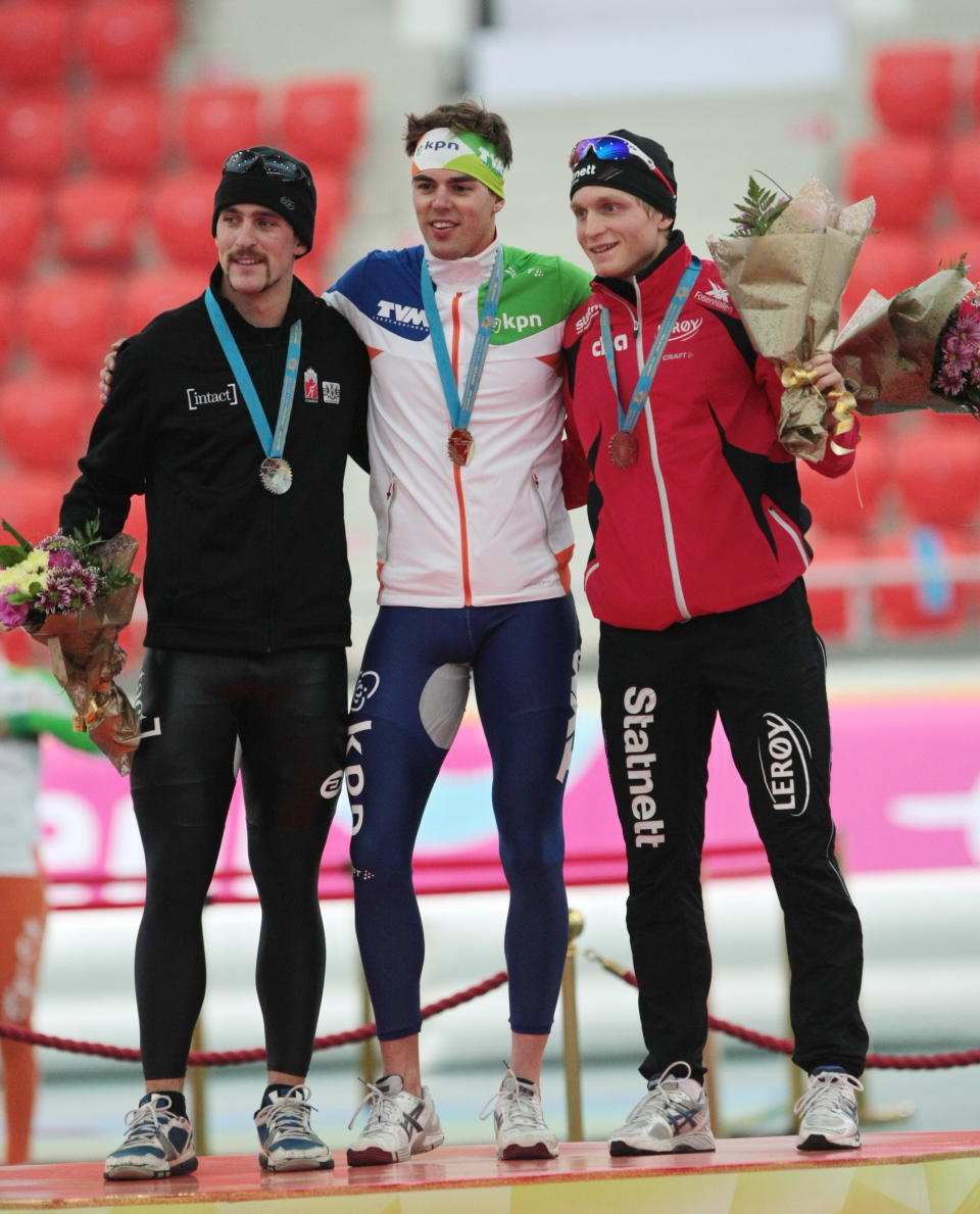 The winners in the Men's 1500 m, (L-R)  Canada's Denny Morrison with silver medal, Wouter olde Heuvel of The Netherlands  with gold medal, and Norway's Havard Bokko  with bronze medal, pose at the podium during the Essent ISU World Cup Astana on November 25, 2011,  in Astana, Kazakhstan.AFP AFP PHOTO / STANISLAV FILIPPOV (Photo credit should read STANISLAV FILIPPOV/AFP/Getty Images)