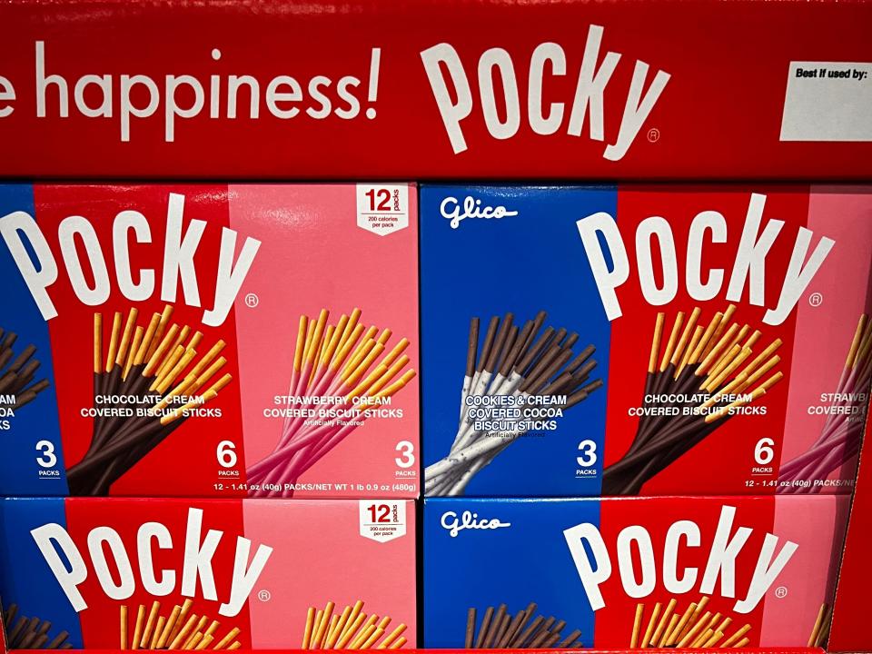 Boxes of Pocky on display at Costco. Each box includes three packs of the cookies-and-cream flavor, six packs of the chocolate-cream flavor, and three packs of the strawberry-cream flavor.