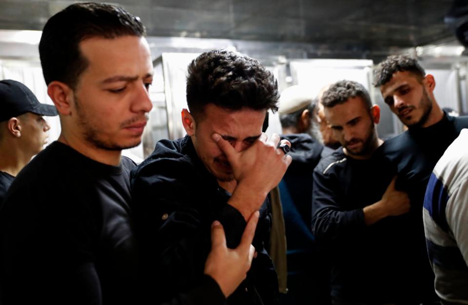 Relatives mourn during the funeral of Reema Telbani and her 5-year-old son Zaid, who were killed in Israeli airstrikes on an apartment building in GazaAP