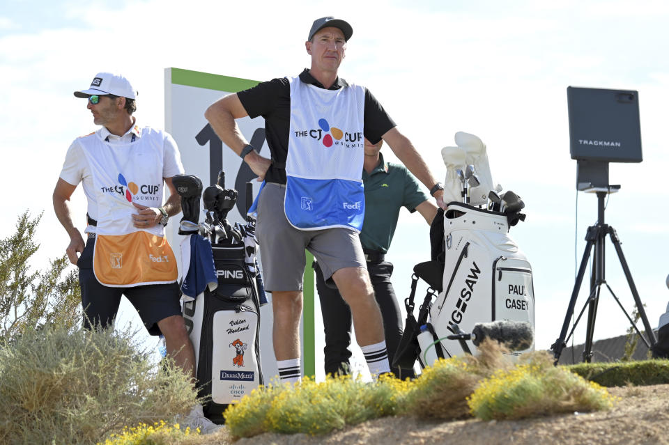 John McLaren, center, caddie for Paul Casey, looks on at the 16th tee box during the final round of the CJ Cup golf tournament Sunday, Oct. 17, 2021, in Las Vegas. (AP Photo/David Becker)