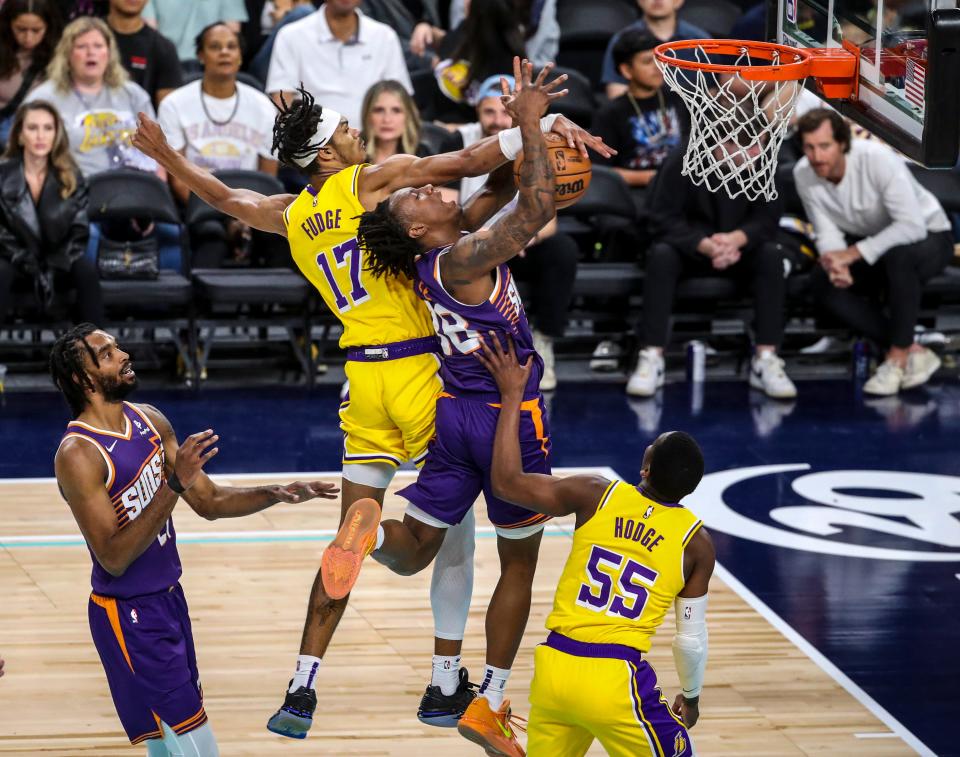 Phoenix Suns guard Saben Lee (38) tries to shoot as he's blocked by Los Angeles Lakers forward Alex Fudge (17) during the fourth quarter of their preseason game at Acrisure Arena in Palm Desert, Calif., on Oct. 19, 2023.