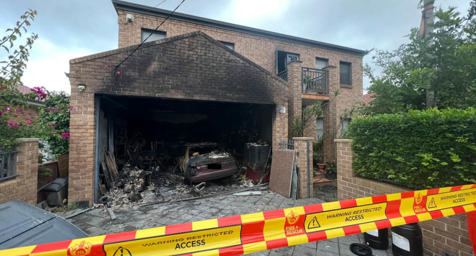 Burnt home and car after e-bike exploded causing fire in Sydney. 