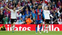 Britain Football Soccer - Crystal Palace v Manchester United - FA Cup Final - Wembley Stadium - 21/5/16 Manchester United's Wayne Rooney and Daley Blind celebrate winning the final as Crystal Palace's Jason Puncheon looks dejected Action Images via Reuters / Jason Cairnduff