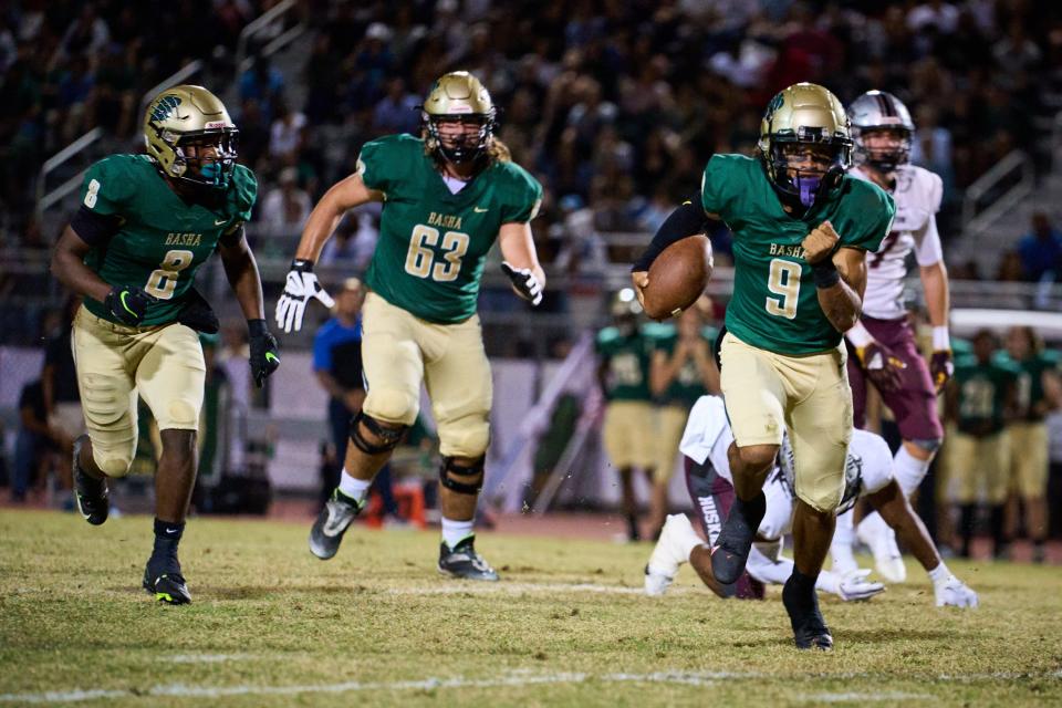 Basha Bears junior quarterback Demond Williams Jr. (9) rushes the ball against the Hamilton Huskies at Basha High School football stadium in Chandler on Oct. 20, 2022.