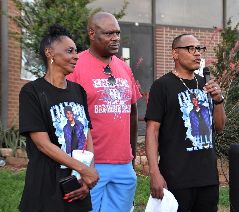 Lucious Jeffery (right) and Donna Jeffery (left) stand in front of the large crowd to give a speech about their late son Cha'Quon Jeffery during a balloon release on Thursday, June 8, 2023 at the Hirschi Field House parking lot.