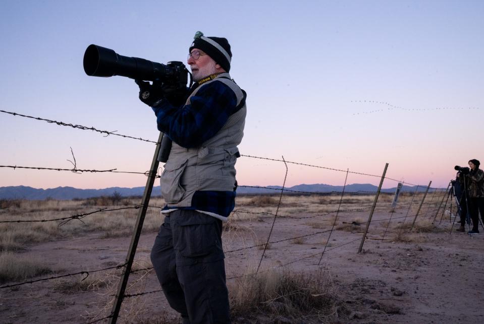 Dan Walters photographs sandhill cranes at sunrise, January 29, 2022, from Davis Road north of the Whitewater Draw Wildlife Area, McNeal, Arizona.