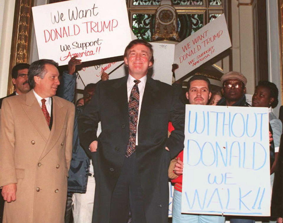 Donald Trump enters the Plaza Hotel in New York past supporters in December 1994. Hundreds of supporters showed up at a news conference where Trump denied a New York newspaper report that the Sultan of Brunei had bid $300 million to buy the&nbsp;Manhattan hotel.