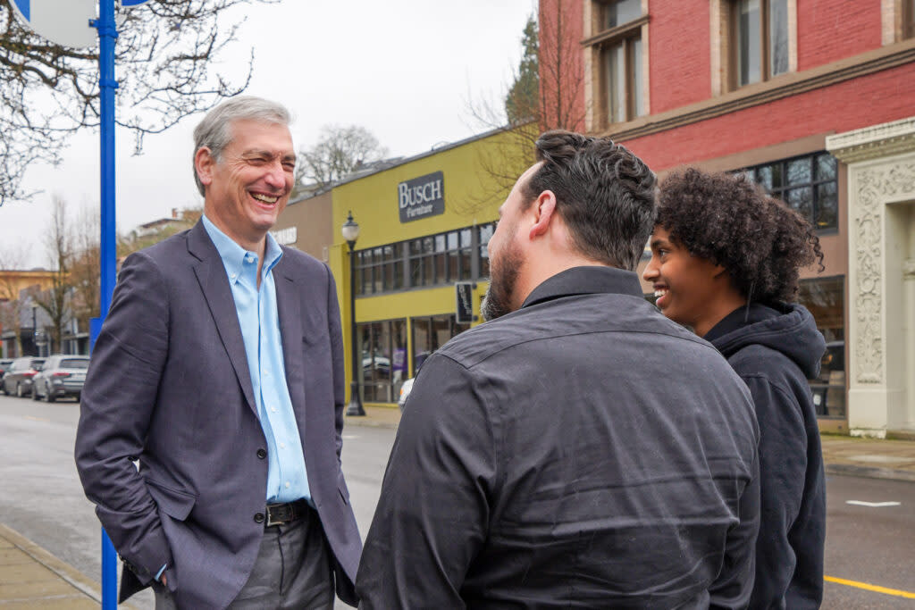 Jeff Gudman (left) talks with his campaign manager (middle) Zach Bayer and Bayer's son in Oregon City in early 2024.