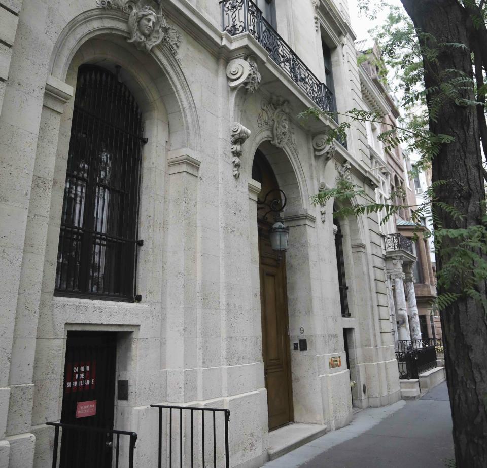 This photo shows the Manhattan residence of Jeffrey Epstein, Monday July 8, 2019, in New York. Prosecutors said Monday, federal agents investigating wealthy sex offender Jeffrey Epstein found "nude photographs of what appeared to be underage girls" while searching his Manhattan mansion. (AP Photo/Bebeto Matthews)