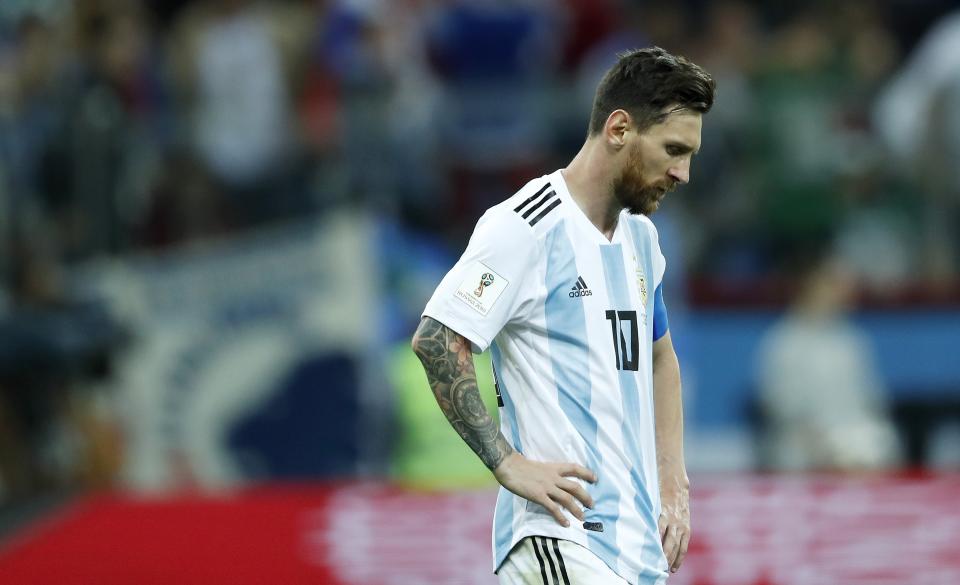 Despondent: Lionel Messi stands dejected as his Argentina side sit on the brink of World Cup elimination. (Getty)