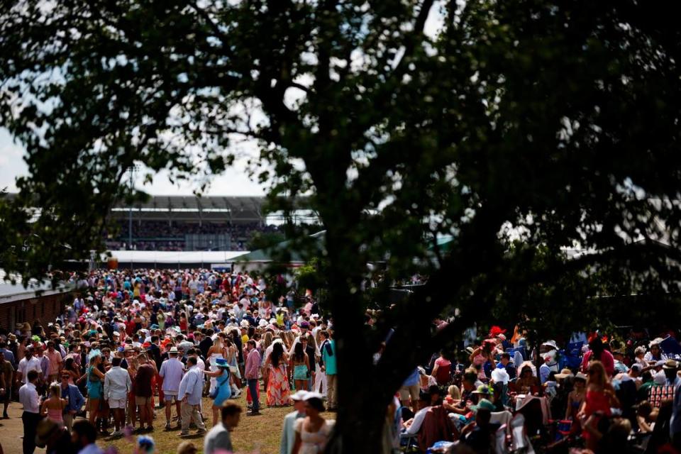 Spectators gather in the infield before the 150th running of the Kentucky Derby at Churchill Downs.