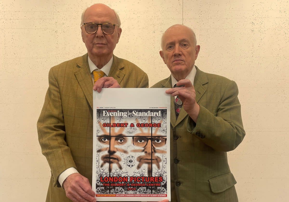 Gilbert and George with today’s specially designed front cover of the Evening Standard (ES)