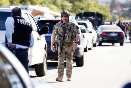 Police officers secure the area after at least one person opened fire at a social services agency in San Bernardino, December 2, 2015. REUTERS/Mario Anzuoni