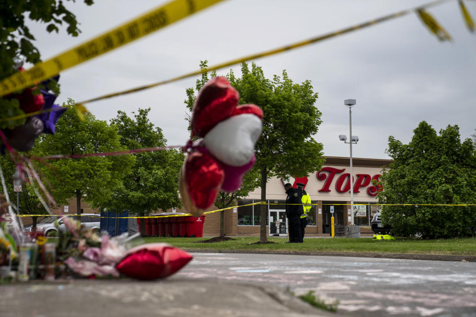 People gather at the scene of a mass shooting at Tops Friendly Market (Kent Nishimura / Los Angeles Times via Getty Images file)