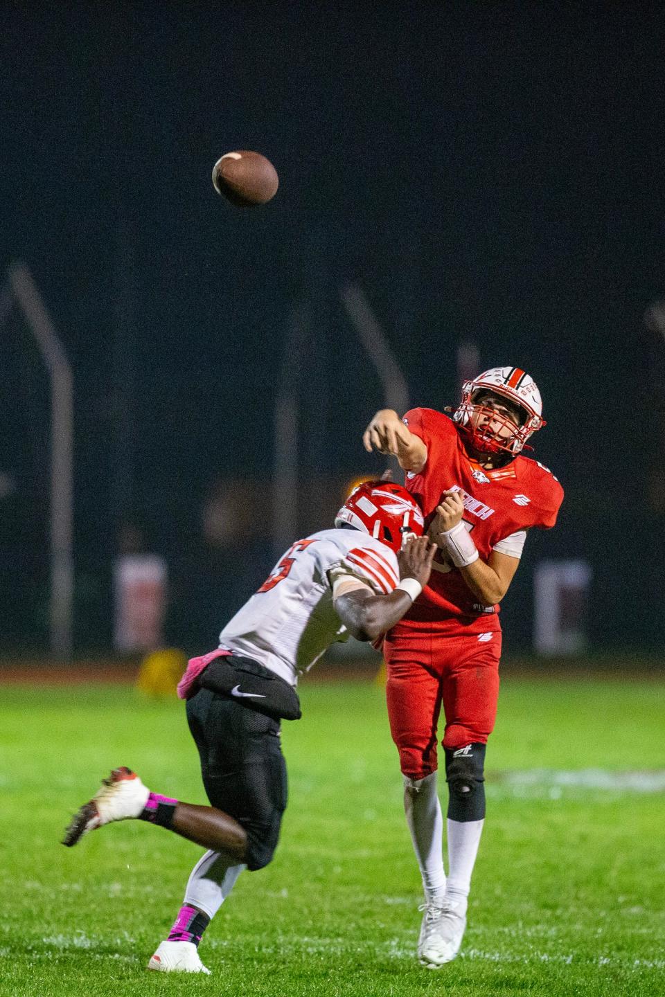 Point Pleasant Beach's quarterback Thomas Wagner is challenged by Keyport's Mekai Henderson as he passes the ball during the first half of the Keyport High School vs. Point Pleasant Beach High School football game at Donald T. Fioretti Field in Point Pleasant Beach, NJ Friday, October 6, 2023.