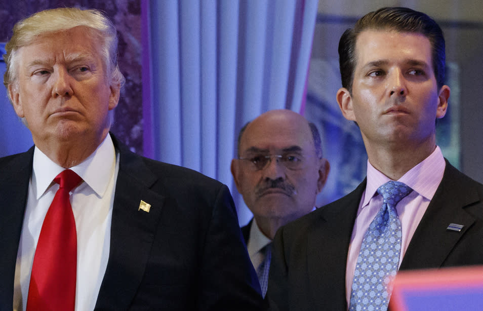 FILE - This file photo from Wednesday Jan. 11, 2017, shows President-elect Donald Trump, left, his chief financial officer Allen Weisselberg, center, and his son Donald Trump Jr., right, during a news conference at Trump Tower in New York. Prosecutors in New York are expected to bring the first criminal charges in a two-year investigation into Trump's business practices, accusing his namesake company and its longtime finance chief Weisselberg of tax crimes. (AP Photo/Evan Vucci, File)