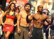 Manny Pacquiao (C) of the philippines and Timothy Bradley of US (R) attend weigh-in session at the MGM Grand Arena in Las Vegas, Nevada on June 08, 2012. Pacquiao and Bradley will fight on June 9. AFP PHOTO / JOE KLAMARJOE KLAMAR/AFP/GettyImages